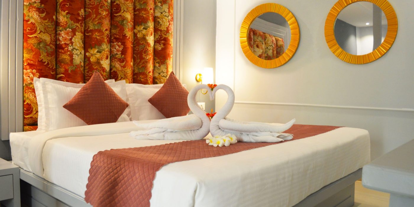 Romantic honeymoon couple enjoying private pool at luxury resort in Vagator Goa