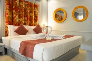 Romantic honeymoon couple enjoying private pool at luxury resort in Vagator Goa